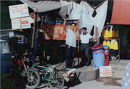 Filipino preachers preaching at the market