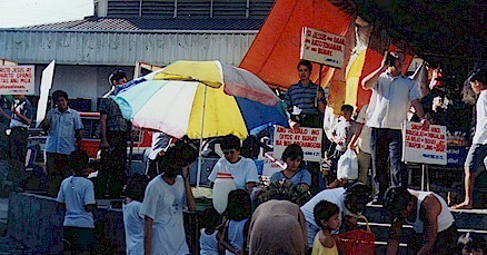 Filipino preachers preaching at the market